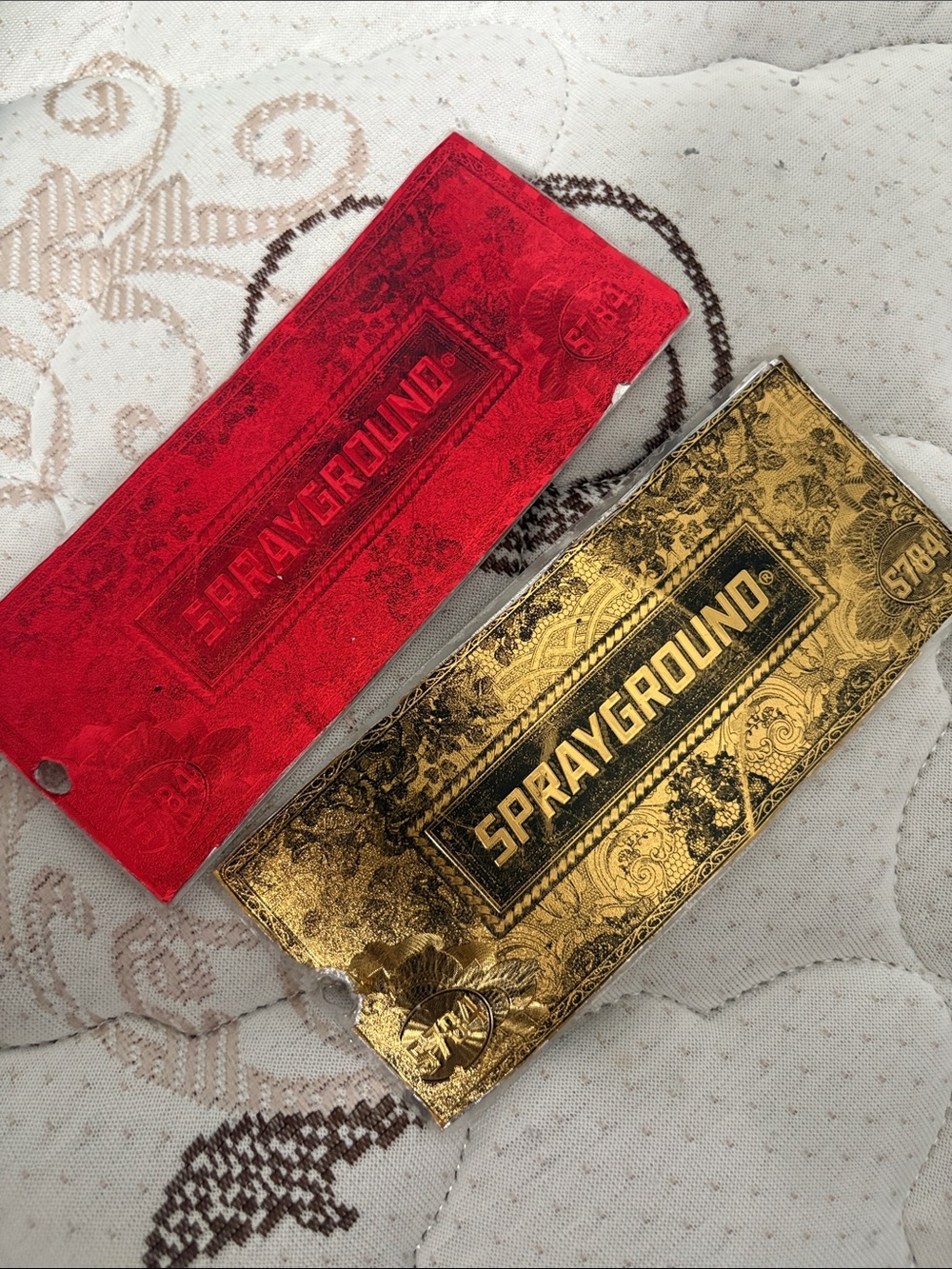 Sprayground Gold and Red Embossed Money Sleeve Duo
